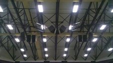 Speakers hanging up in gym after installation
