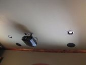 Projector with in-ceiling surround sound speakers