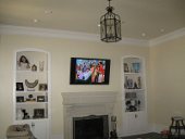 TV mounted above inside fireplace